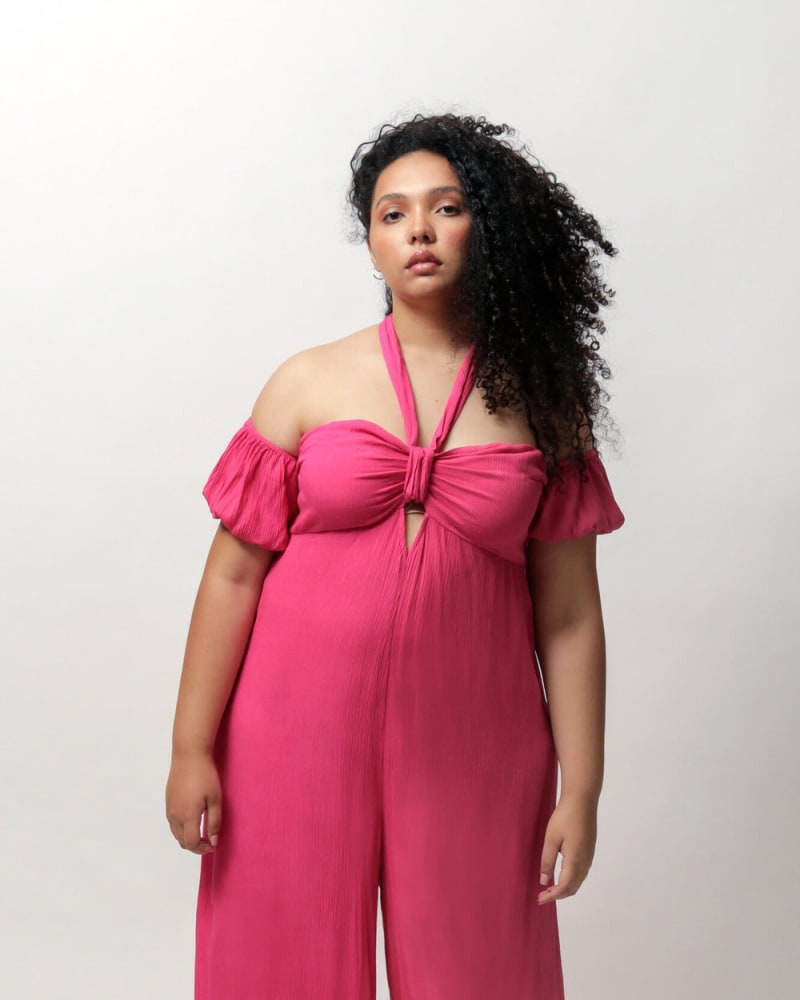Front of a model wearing a size L Amelia Off The Shoulder Jumpsuit in Beetroot Purple by LuvMeMore. | dia_product_style_image_id:266607